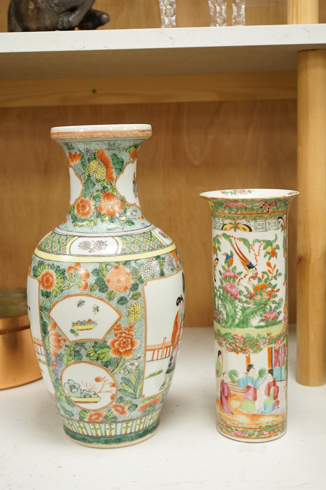 Two Chinese porcelain vases to include a famille rose sleeve vase and a larger famille verte vase, 36cm high